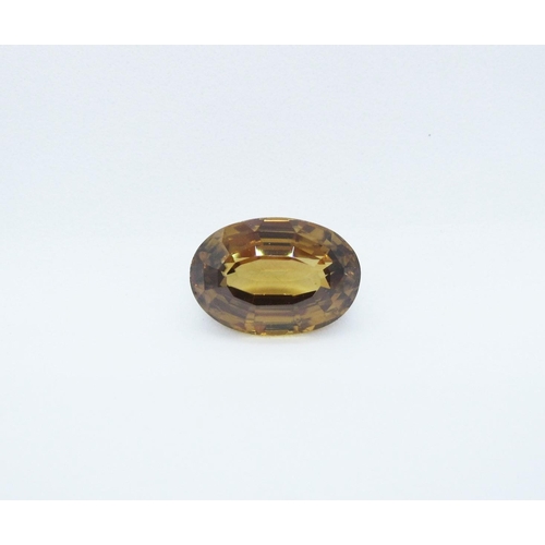 526 - An unmounted oval cut bronze Zircon, 7.27 cts.