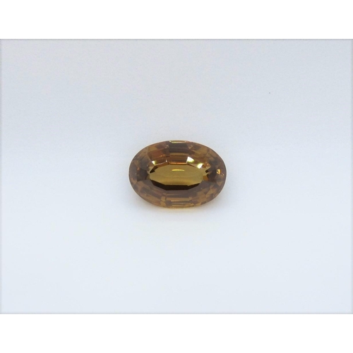 526 - An unmounted oval cut bronze Zircon, 7.27 cts.