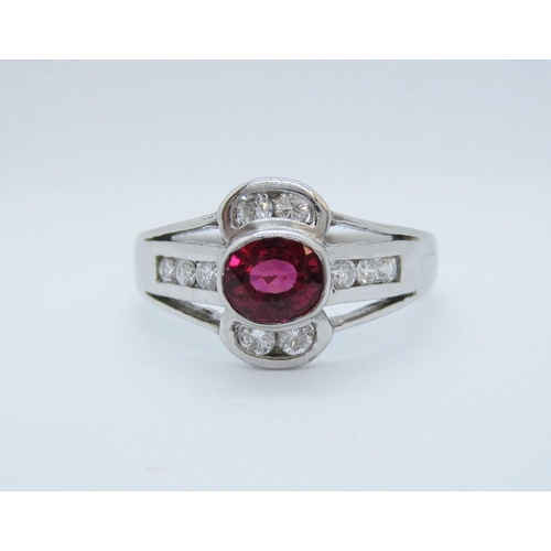 529 - A Ruby and Diamond Ring rubover-set oval-cut ruby within channel-set brilliant-cut diamonds in 18ct ... 