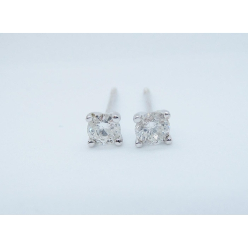 542 - A pair of Diamond Ear Studs each claw-set brilliant-cut stone in 18ct white gold, total diamond weig... 