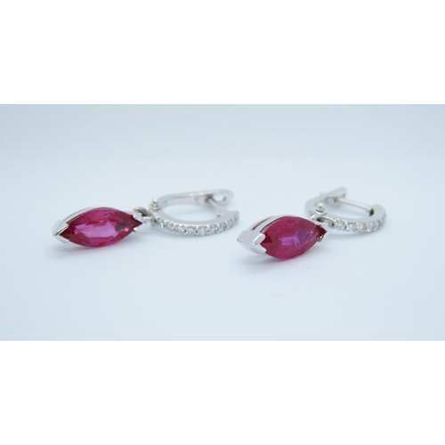 544 - A pair of Ruby and Diamond drop Earrings, each pavé-set, a line of brilliant-cut diamonds suspending... 