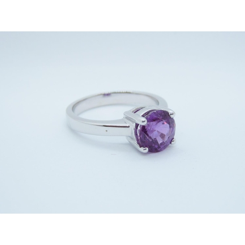 562 - A Purple Sapphire single stone Ring claw-set round stone, 2.47cts, in 18ct white gold, ring size L1/... 