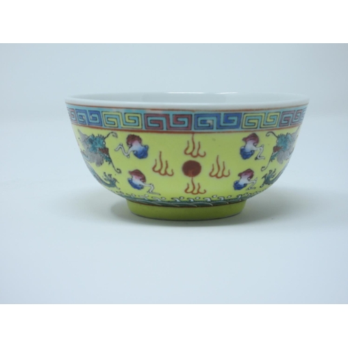 573 - A Chinese Bowl decorated dragons on yellow ground, 
4 1/2 in.