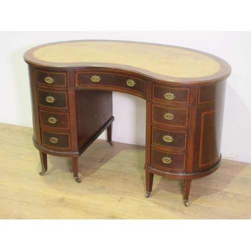 75 - A late Victorian mahogany kidney shaped Writing Desk with leather inset top, fitted nine drawers on ... 