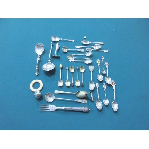 596 - A collection of silver and white metal Teaspoons, Souvenir Spoons, Teething Ring, etc.