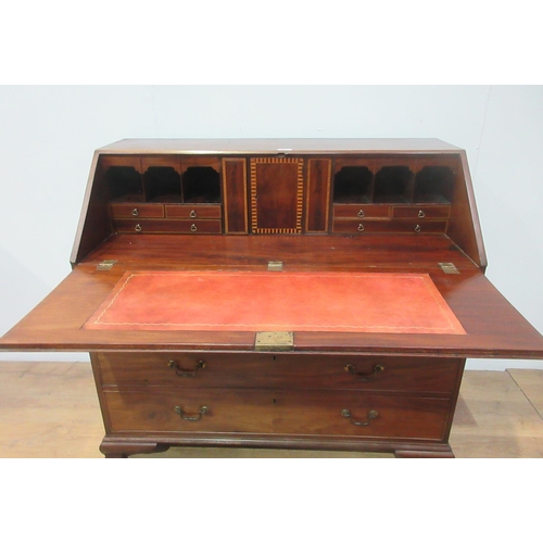 95 - A George III mahogany Bureau with sloping fall front enclosing a boxwood inlaid fitted interior abov... 