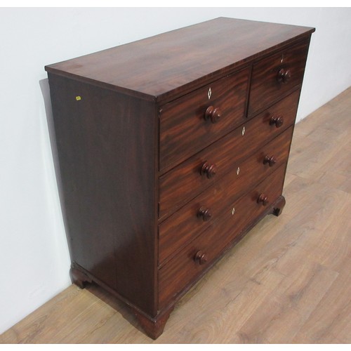 262 - A 19th Century mahogany Chest of two short and three long graduated drawers with turned knob handles... 