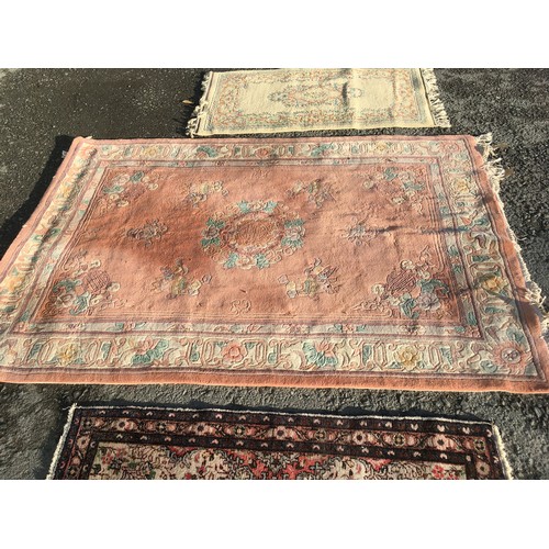 7 - A pink ground Chinese Rug with stylised floral decoration 8ft 4in L X 5ft 6in W, a small cream groun... 