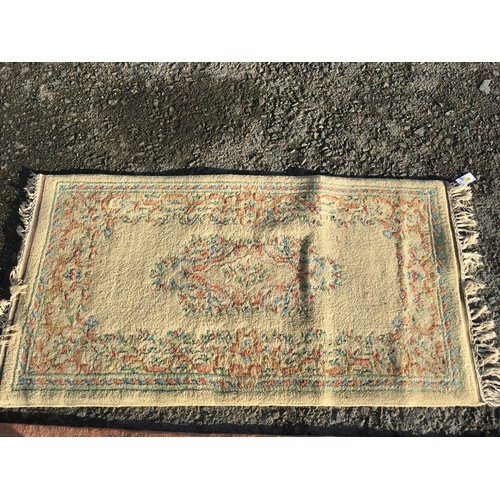 7 - A pink ground Chinese Rug with stylised floral decoration 8ft 4in L X 5ft 6in W, a small cream groun... 