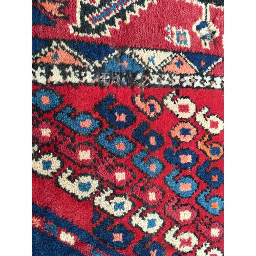 11 - A red ground woollen Rug 8ft 1in L x 5ft 7in W and another with blue waisted centre 5ft 9in L x 4ft ... 