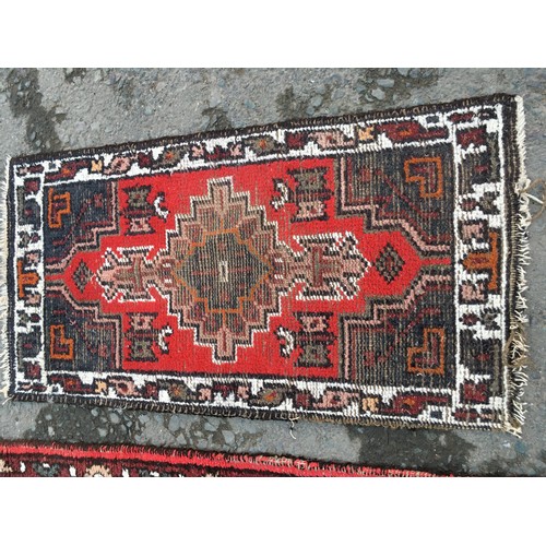 14 - A fine woven claret ground Rug with five central guls 5ft 4in L x 3ft W, a blue Chinese Rug 4ft 3in ... 