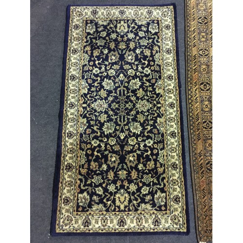 16 - A brown Oriental Rug with two rows of stylised flowers within tramline border 5ft 4in L x 3ft 4in W ... 