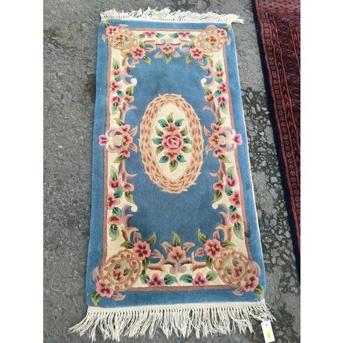 14 - A fine woven claret ground Rug with five central guls 5ft 4in L x 3ft W, a blue Chinese Rug 4ft 3in ... 