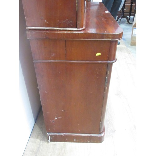 649 - A Victorian mahogany veneered Bookcase the upper section fitted two glazed doors enclosing adjustabl... 