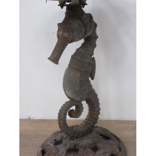 206 - A metal Bird Bath with scallop shaped top on seahorse column and circular base 2ft 2in H x 1ft 6in W