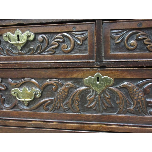 224 - A late 18th Century oak Chest of two short and three long drawers beneath moulded top with later car... 