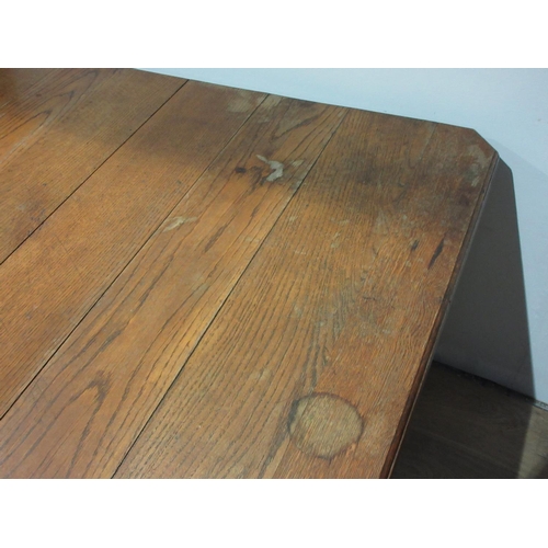 229 - An oak extending Dining Table on square cut supports 4ft L x 2ft 3in H