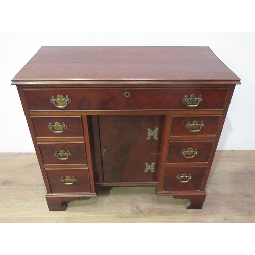 240 - A mahogany kneehole Desk in the George III style fitted single frieze drawer above two banks of thre... 