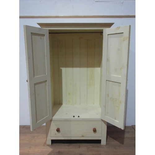 267 - A modern cream painted Cupboard fitted pair of panelled doors above drawer on stile supports 6ft 4in... 