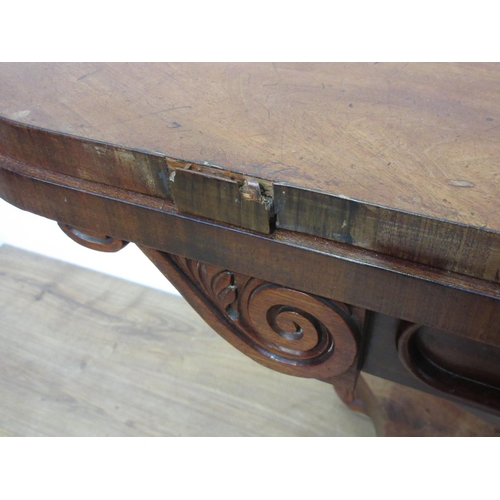 269 - A Victorian mahogany fold over Card Table mounted upon octagonal supports and four scroll feet and c... 