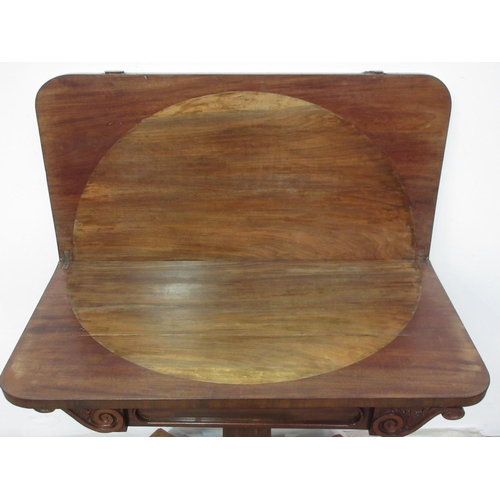 269 - A Victorian mahogany fold over Card Table mounted upon octagonal supports and four scroll feet and c... 