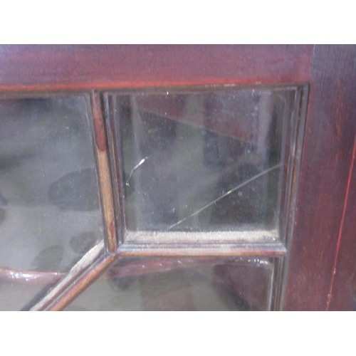 283 - A 19th Century mahogany hanging Corner Cabinet fitted single astragal glazed door and decorated with... 