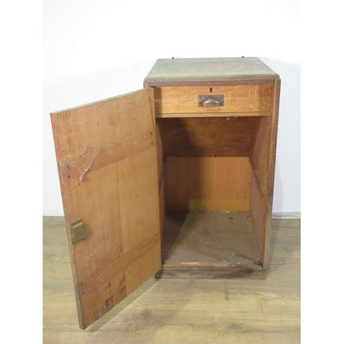 286 - A 20th Century Heal's style oak Cupboard fitted with single door enclosing a drawer 2ft 8in H x 1ft ... 