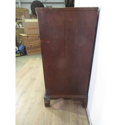 288 - A 19th Century oak Chest of two short and three long drawers with turned handles raised on tall ogee... 