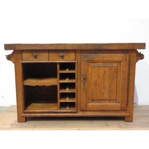 306 - An oak Kitchen Island with granite inset work surfaces fitted single drawer and a panelled cupboard ... 