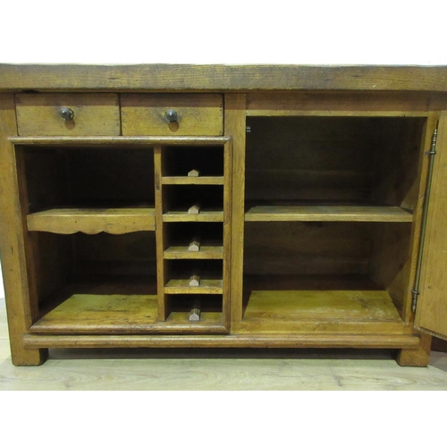 306 - An oak Kitchen Island with granite inset work surfaces fitted single drawer and a panelled cupboard ... 