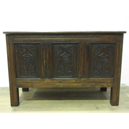 307 - An oak Coffer in the 17th Century style with sunken three panel lid and three panel front carved wit... 