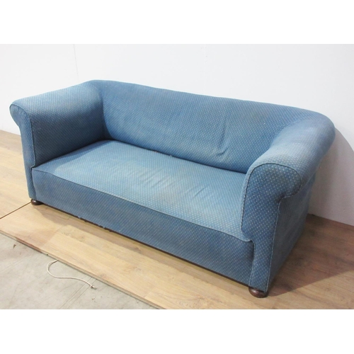 310 - A blue upholstered Chesterfield Settee on turned supports 6ft 3in W x 3ft D