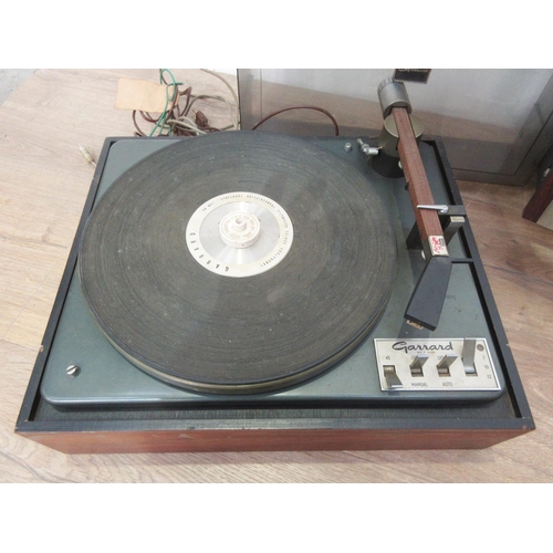 402 - A Garrard Turntable, a pair of Speakers and a Pioneer Amplifier