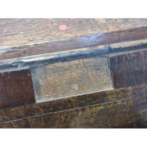 410 - A 19th Century oak Desk with sloping front, fitted interior and fitted frieze drawer on turned and s... 