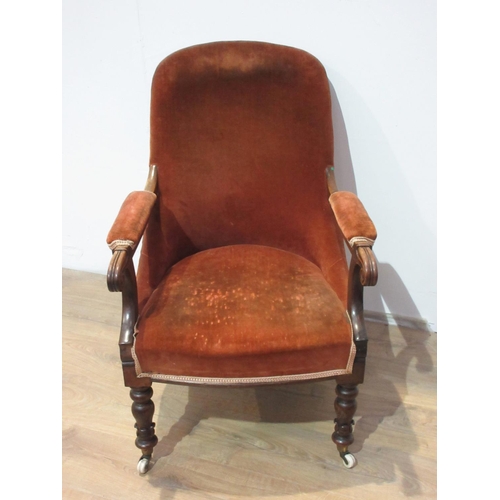 413 - A 19th Century rosewood and upholstered Armchair with scrolled arms and turned front supports and ca... 