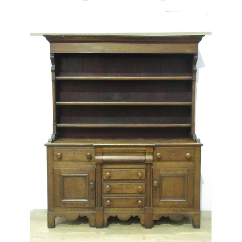 424 - A 19th Century oak Dresser and Rack, the base fitted drawers and cupboards, 6 ft 9 in H x 5 ft 6 in ... 