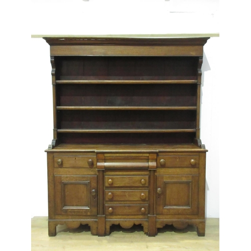 424 - A 19th Century oak Dresser and Rack, the base fitted drawers and cupboards, 6 ft 9 in H x 5 ft 6 in ... 