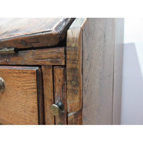 432 - An antique oak Bureau fitted three long drawers on bracket supports, 2 ft 9 in W x 3 ft 4 in H x 18 ... 