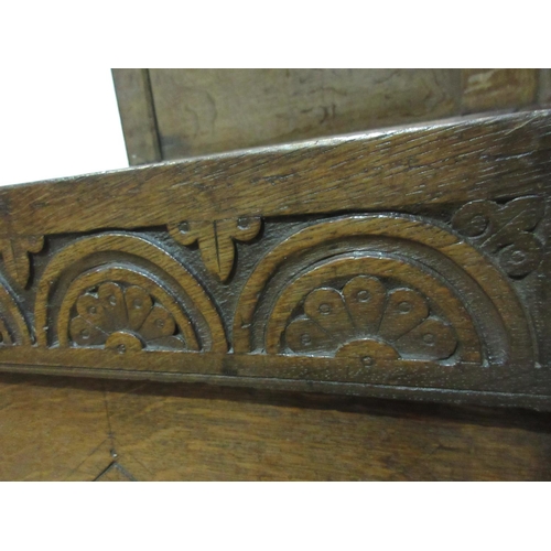 437 - A late 17th Century Coffer with two panel sunken lid above a lunette carved frieze and diamond carve... 