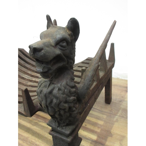 477 - A pair of cast iron Fire Dogs in the form of Griffins with grate 1ft 3in L