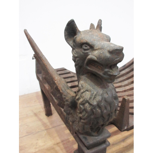 477 - A pair of cast iron Fire Dogs in the form of Griffins with grate 1ft 3in L