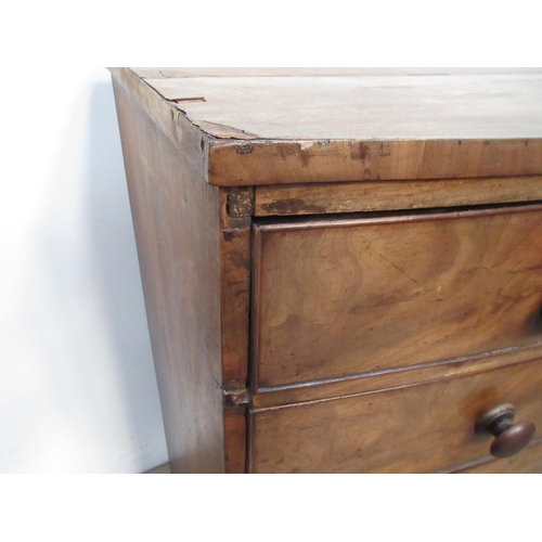 493 - A Victorian mahogany bow fronted Chest of two short and three long drawers with turned knobs mounted... 