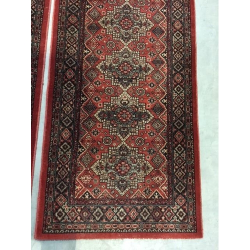 5 - Two modern red ground Runners 8ft 2in L x 2ft 7in W and a Chinese cream Rug 5ft L x 2ft 6in W