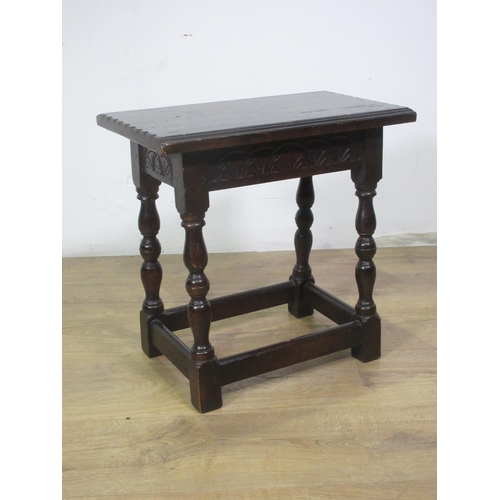 500 - A 20th Century oak Joint Stool with carved frieze on baluster turned supports 11in