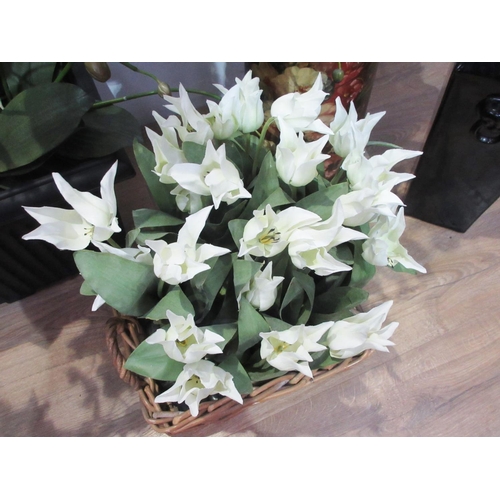 519 - A pair of black ceramic square section Vases with a display of artificial flowers and another three ... 