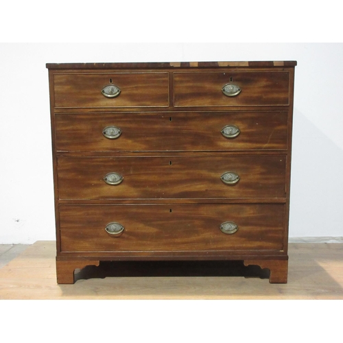 527 - A 19th Century mahogany Chest of two short and three long drawers with brass handles mounted on ogee... 