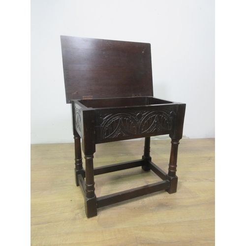 533 - A reproduction Box Stool in the 17th Century style with lunette carved frieze mounted upon barrel tu... 