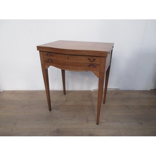 554 - A Sewing Machine in reproduction serpentine fronted Table with two dummy drawers 2ft 8in H x 2ft 3in... 