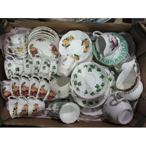 557 - Three boxes of part Tea Services and blue and white Platters