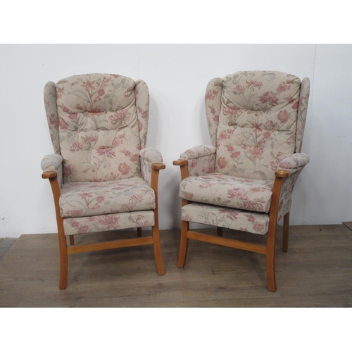 575 - A pair of upholstered Armchairs.